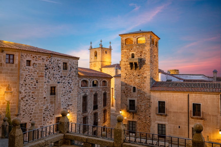 photo of view of View of the Plaza de San Jorge, with the Tower of the Los Golfines de Abajo palace as the protagonist, in Cáceres, Spain.