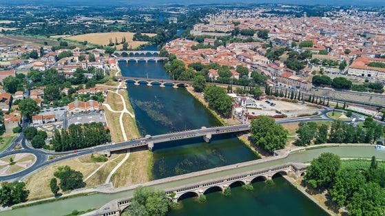 Photo of Aerial top view of Beziers town, river and bridges from above, South France.