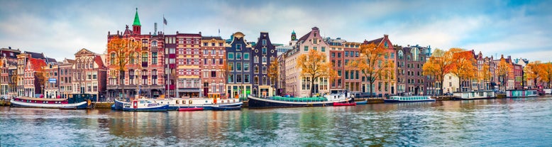 Amsterdam Netherlands dancing houses over river Amstel landmark in old european city spring landscape.