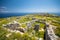 photo of view of The ruins of ancient Thira, a prehistoric village at the top of the mountain Mesa Vouno, Santorini, Greece.