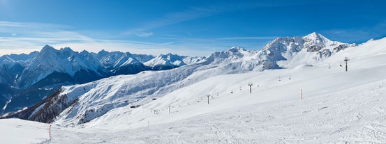 Photo of  beautiful Scuol town in Swiss Alps and Inn river, Switzerland.