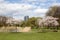 photo of Riga, Latvia - may 05, 2021: Blooming cherry sakura in Victory park (Uzvaras parks) with Z tower on background in Riga, Latvia.