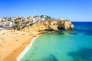 Photo of aerial view of touristic Portimao with wide sandy Rocha beach, Algarve, Portugal.