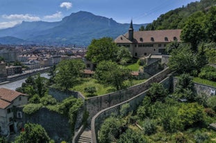 Photo of morning cityscape view with mountains, river and bridge in Grenoble city on the south-east of France.