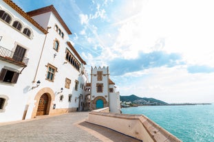 Photo of Sand beach and historical Old Town in mediterranean resort Sitges near Barcelona, Costa Dorada, Catalonia, Spain.