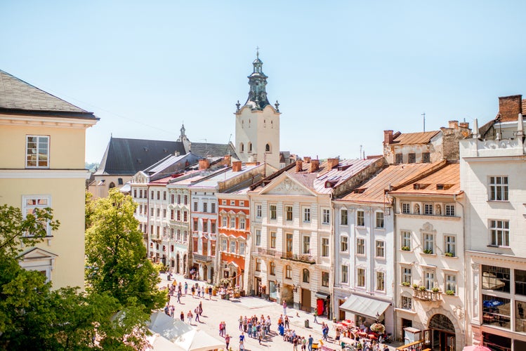 Photo of cityscape view on the old town with beautiful buildings and tower of Latin cathedral during the sunny weather in Lviv city in Ukraine.