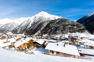 Photo of The mountain village at the Austrian ski resort Soelden on a cold and sunny winter day.