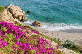 Photo of aerial view of the town of Nerja with the beautiful beach, Málaga, one of the white villages of Andalusia, Spain.