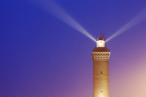 photo of Lighthouse of Genoa at sunset. Genoa, Liguria, Italy,