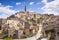 Photo of panoramic view of the ancient town of Matera (Sassi di Matera), European Capital of Culture 2019, in beautiful golden morning light with blue sky and clouds, Basilicata, southern Italy.