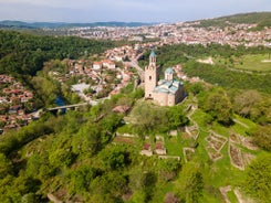 Photo of aerial view of The Cathedral of the Assumption and Varna city at amazing sunset, Bulgaria.