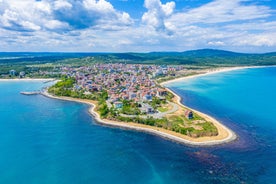 Photo of panoramic aerial view over small ancient resort town of Pomorie with old European small houses , Bulgaria.