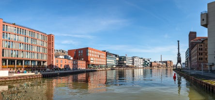 Photo of beautiful panoramic view of historic Bremen Market Square in the center of the Hanseatic City of Bremen with The Schuetting and famous Raths buildings on a sunny day with blue sky in summer, Germany.