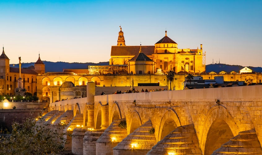 photo of view of Roman Bridge and Mosque Cathedral of Cordoba, Spain travel photo.