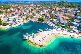 Photo of aerial view of Brodarica village near Sibenik beach and coastline, Dalmatia region of Croatia.