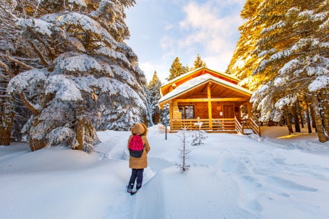 Beautiful winter landscape with snow covered trees. Forest with snow landscape and chalets. Uludag National Park, Bursa.
