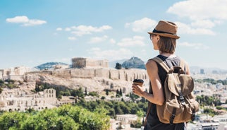 Photo of temple of Apollo with Acrocorinth in the background. Ancient Corinth, Greece.