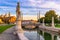 Photo of beautiful view of canal with statues on square Prato della Valle and Basilica Santa Giustina in Padova (Padua), Veneto, Italy.