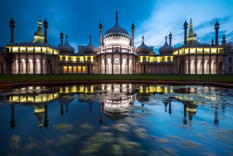 Photo of Royal Pavilion illuminated at night in Brighton, England.