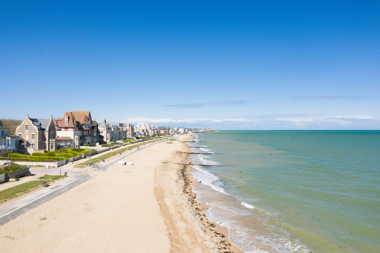 Photo of The long sandy beach of Sword beach in Lion-sur-Mer in Europe, France.