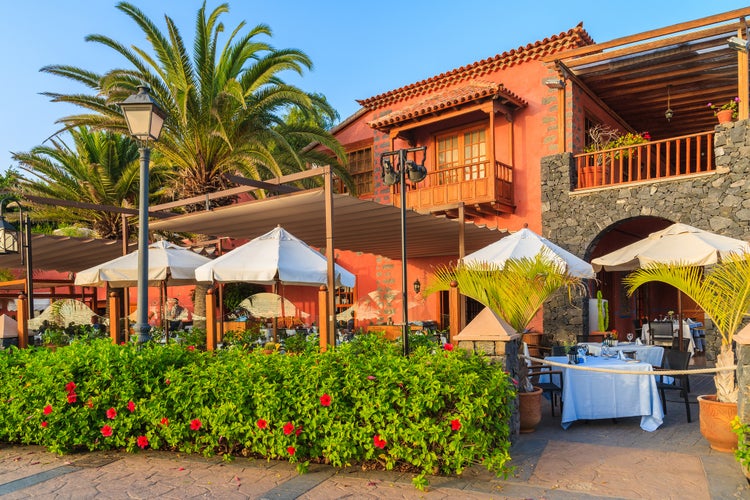 Typcial restaurant built in colonial style on coast of Tenerife island in Costa Adeje seaside town, Canary Islands, Spain