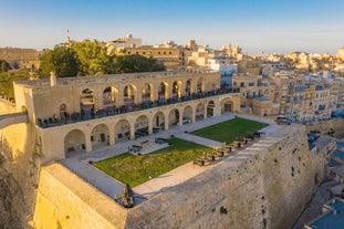 Aerial view of Lady of Mount Carmel church, St.Paul's Cathedral in Valletta embankment city center, Malta.