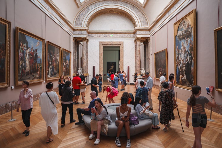 Louvre Museum in Paris, France, filled with a large group of people.jpg