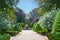 Beautiful path leading to fountain in the Botanical Garden of the University of Coimbra in Portugal. The garden was founded in the 18th century and belongs to the most popular spots in the city.