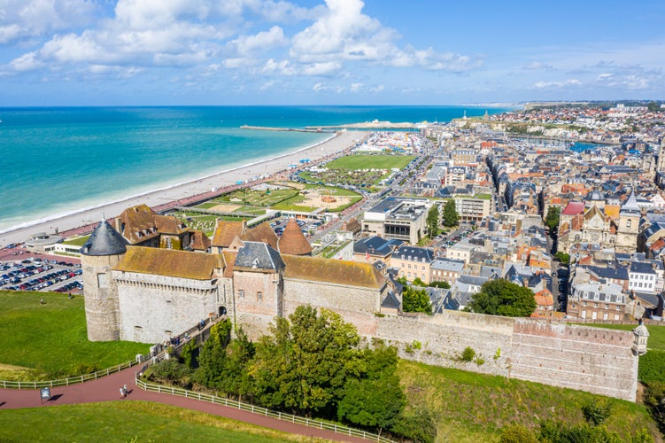 Aerial view of Dieppe town, the fishing port on the English Channel, at the mouth of Arques river. On a clifftop overlooking pebbly Dieppe Beach is the centuries-old Château de Dieppe, now the museum.