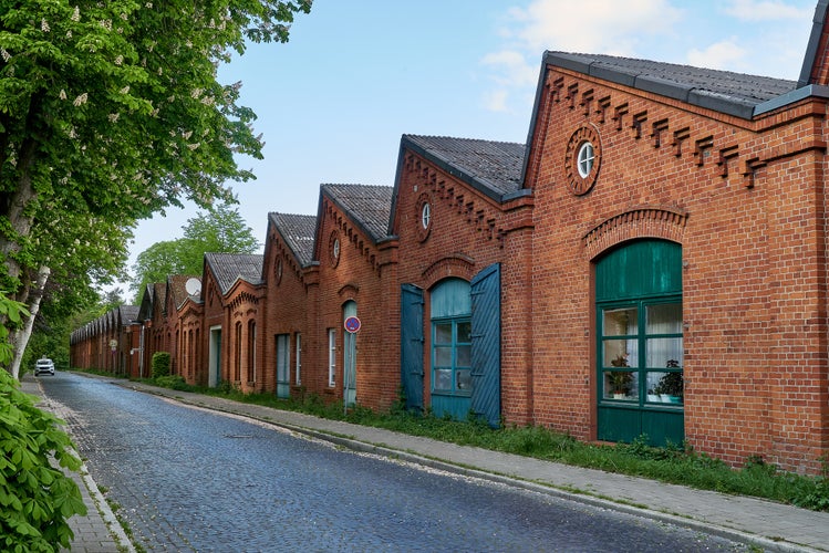 Photo of old traditional factory building of the former spinning mill in Delmenhorst (Germany) now used as apartment house .