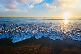 Photo of aerial view of Costa da Caparica coastline of glorious sandy beaches, powerful Atlantic waves, Portugal.