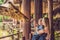 photo of view of Happy mother and son watching and feeding giraffe in zoo. Happy family having fun with animals safari park on warm summer day.,Wolfurt Austria.