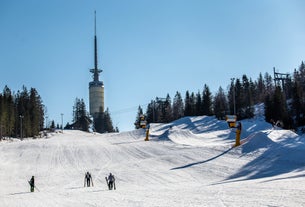 Photo of landscape with mountains, river and buildings in Lillehammer town, Norway.