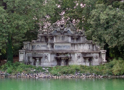 photo of Fountain of Trianon (Fontana del Trianon) in Parma is a real work of art in the center of the city. Monumental creation rises on an island in the middle of a small lake in the Ducal garden.  Read more at: https://it.igotoworld.com/en/poi_object/317346_fountain-trianon-parma.htm