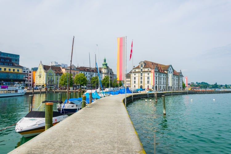 Photo of view of the Kornhaus building and adjacent marina in the swiss city Rorschach, Switzerland.