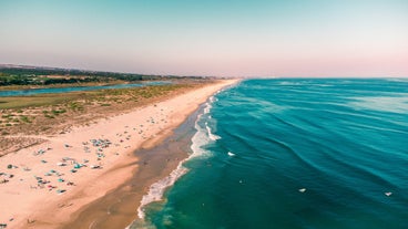 Photo of aerial view of pier fishing boats in the village Cabanas de Tavira, Portugal.