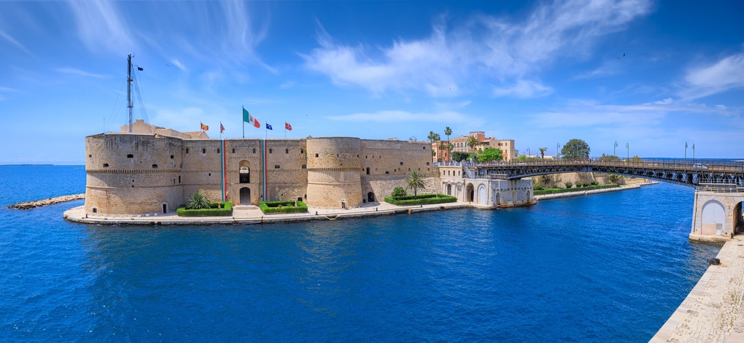 Taranto cityscape: iconic view with Aragonese Castle and Ponte Girevole (Swing Bridge) in Apulia, Italy.