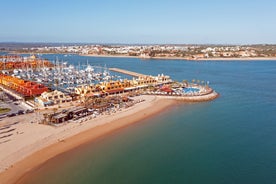 Photo of aerial view of touristic Portimao with wide sandy Rocha beach, Algarve, Portugal.