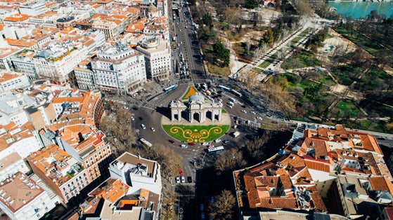 photo of aerial view of the Puerta de Alcalá, Neo-classical monument in the Plaza de la Independencia in Madrid, Spain. One of Madrid's most famous landmarks.