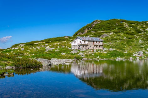 photo of view of Fish lake, one of the seven rila lakes in Bulgaria with Seven lakes hut,Kyustendil Bulgaria.