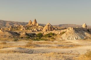 Hot air balloons flying over Uchisar Castle. Cappadocia. Nevsehir Province. Turkey.