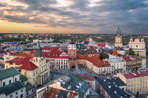 Beautiful panoramic skyline cityscape of Lublin, Lesser Poland. Aerial view of Królewska street and the old town landmarks at sunset: Cracow Gate (Brama Krakowska), Town hall (Ratusz), Cathedral.