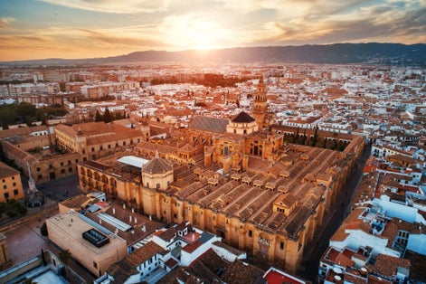 photo of The Mezquita Catedral of Córdoba aerial closeup view at sunset in Spain.