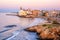 Photo of Sand beach and historical Old Town in mediterranean resort Sitges near Barcelona, Costa Dorada, Catalonia, Spain.