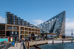 Scenic summer view of Nyhavn pier with color buildings, ships, yachts and other boats in the Old Town of Copenhagen, Denmark