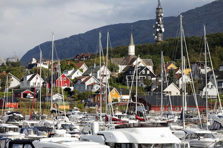 photo of view of Yachts, boats and hillside living in Norwegian harbour town Sandnessjøen.