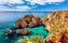 Photo of panoramic beautiful view of Ponta da Piedade with seagulls flying over rocks near Lagos in Algarve, Portugal.