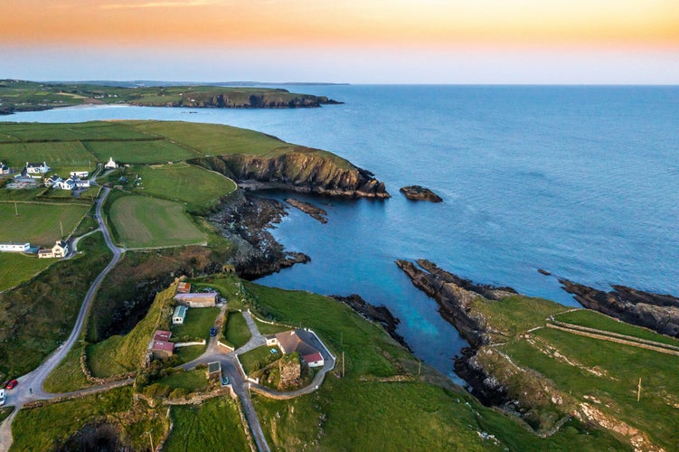 photo of view of Sunset scene at Galley Head Lighthouse in County Cork Ireland.