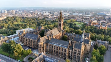 Photo of aerial view of Aberdeen as River Dee flows in a curve to the North Sea showing Duthie Park with bridge and traffic from south.