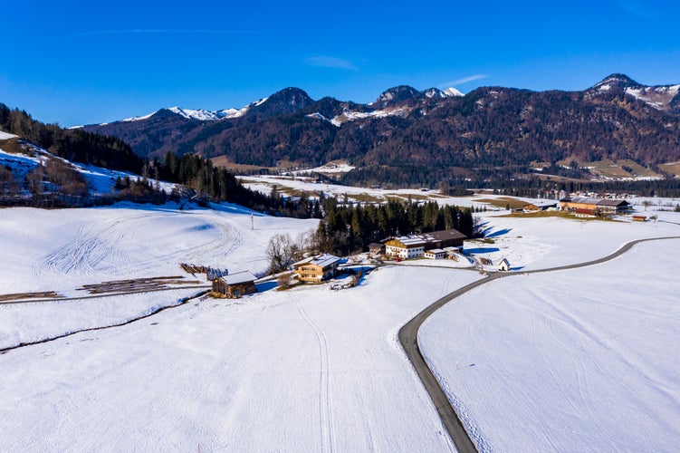 photo of view of Aerial view, view of farms in the Leukental, Kössen, Kaiserwinkl, Kitzbuehel district, Chiemgau, Tyrol, Austria.